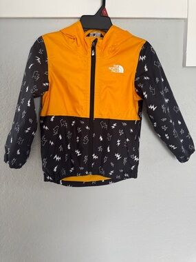 The North Face Kids Yellow and Black Lightning Raincoat light Jacket